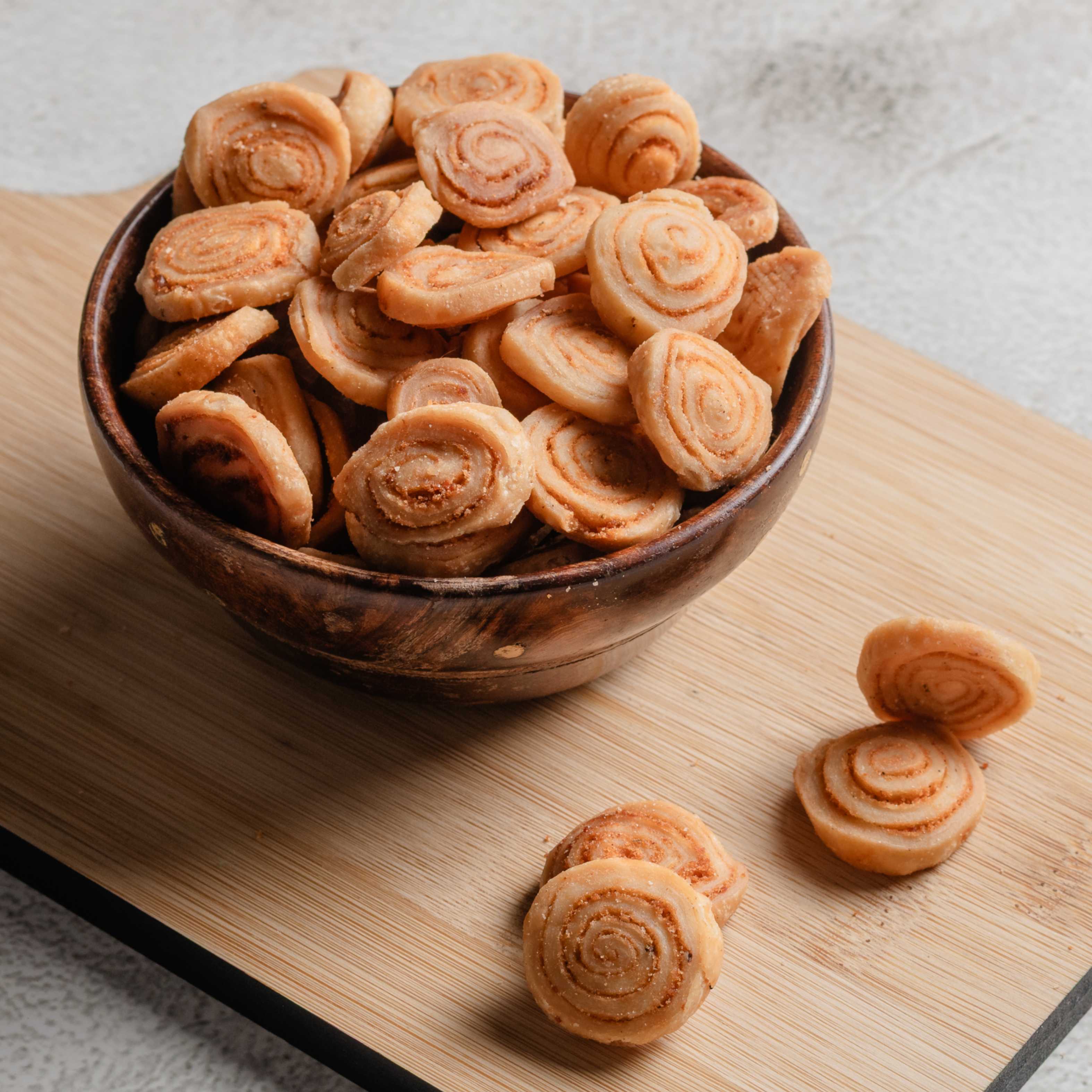 Buy Bhakarwadi snack online from World of Mysore Pak – spicy, crisp Maharashtrian treat for evening munchies.