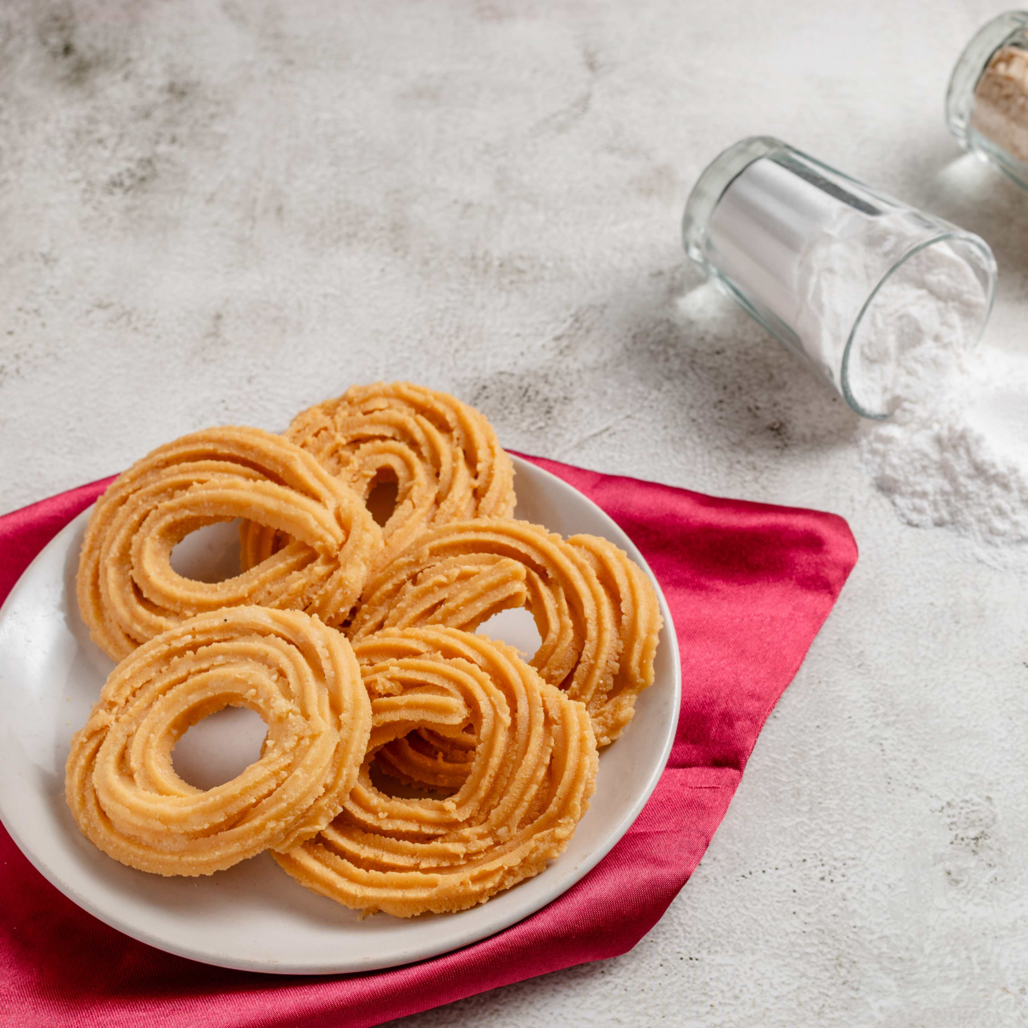 Buy Chakkuli online from World of Mysore Pak – crisp spiral snack made from rice and urad dal flour with Indian spices.