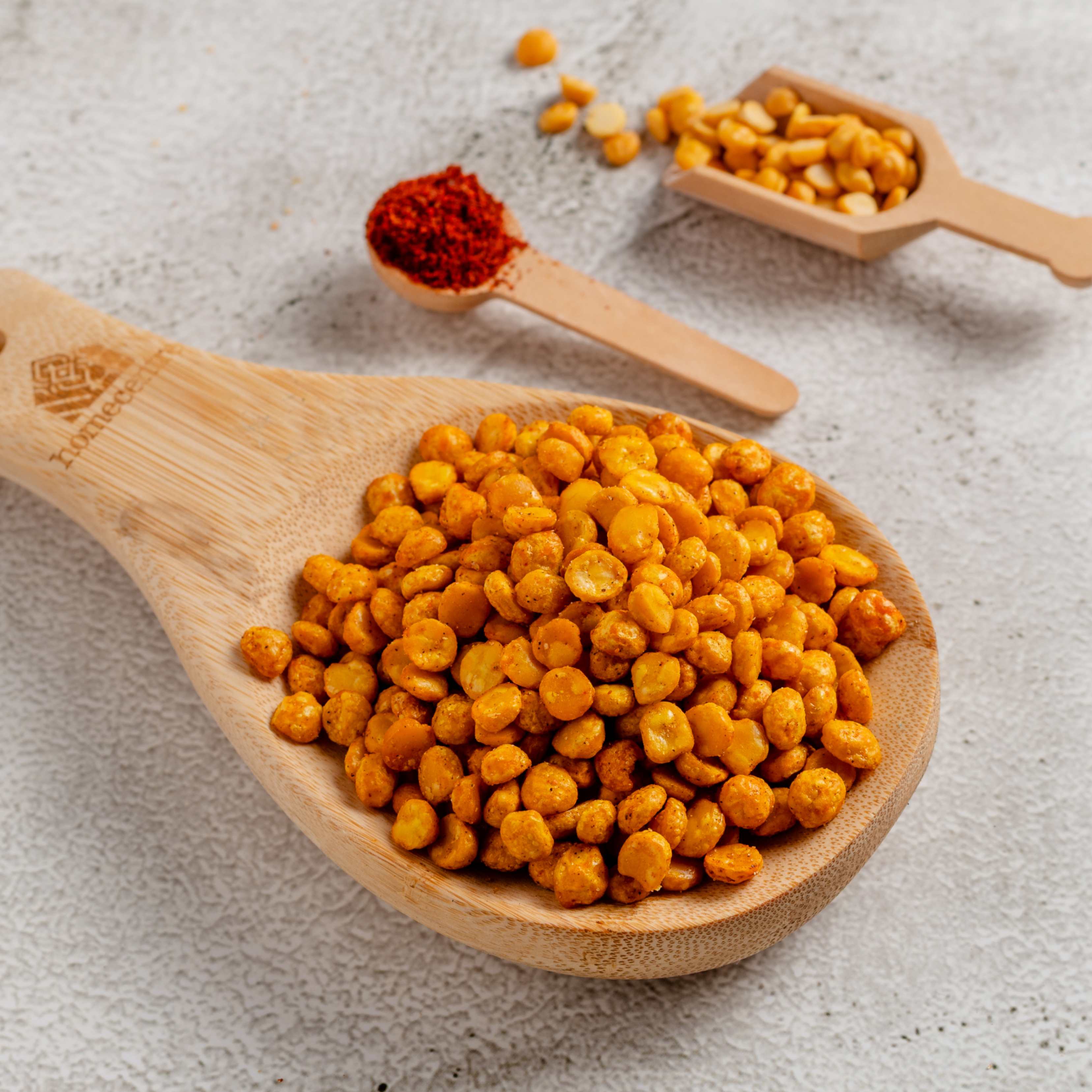 Buy Channa Dal snack online from World of Mysore Pak – crispy, spiced split chickpeas perfect for evening cravings.