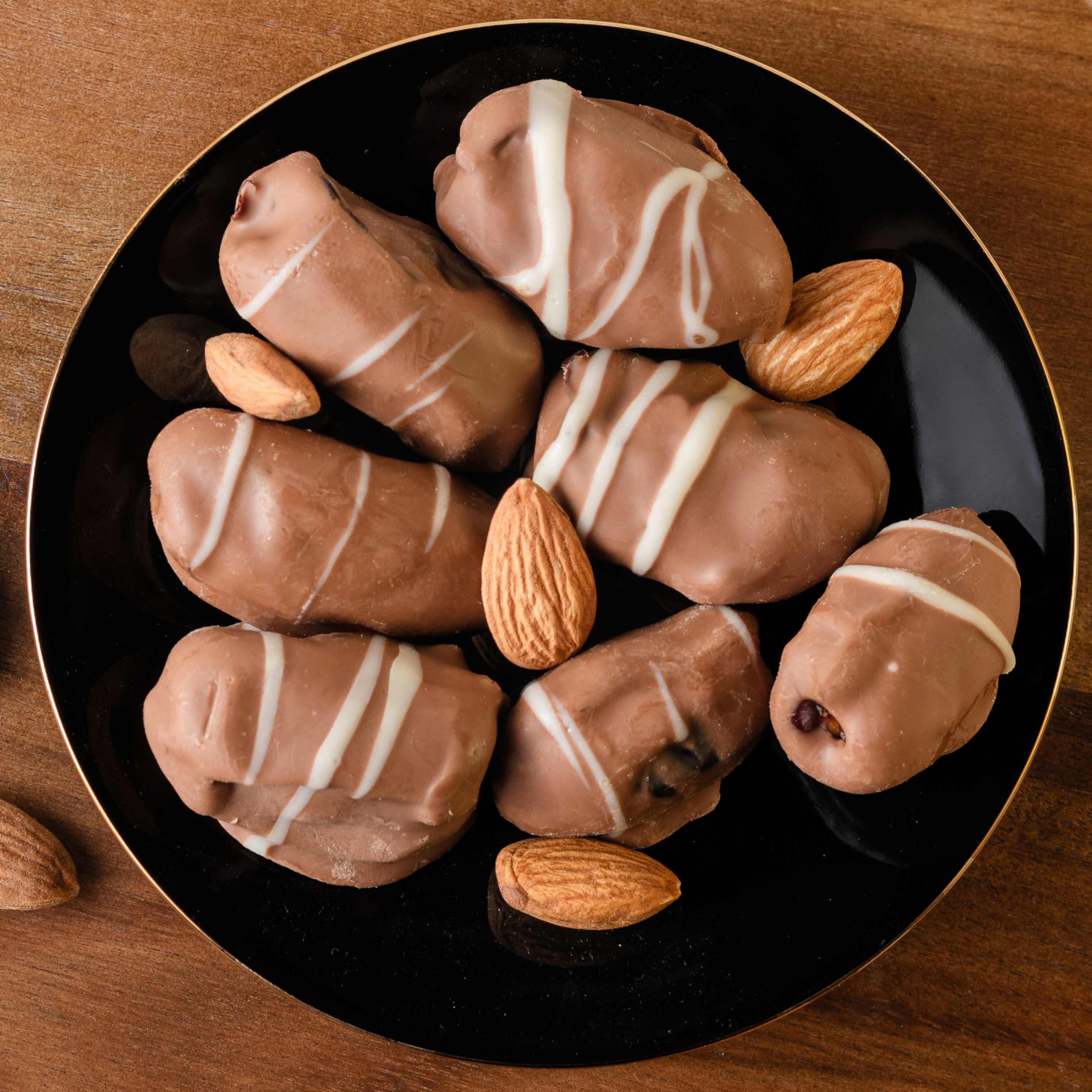 Buy Chocolate Covered Dates with Roasted Almonds online from World of Mysore Pak – sweet and nutty fusion.