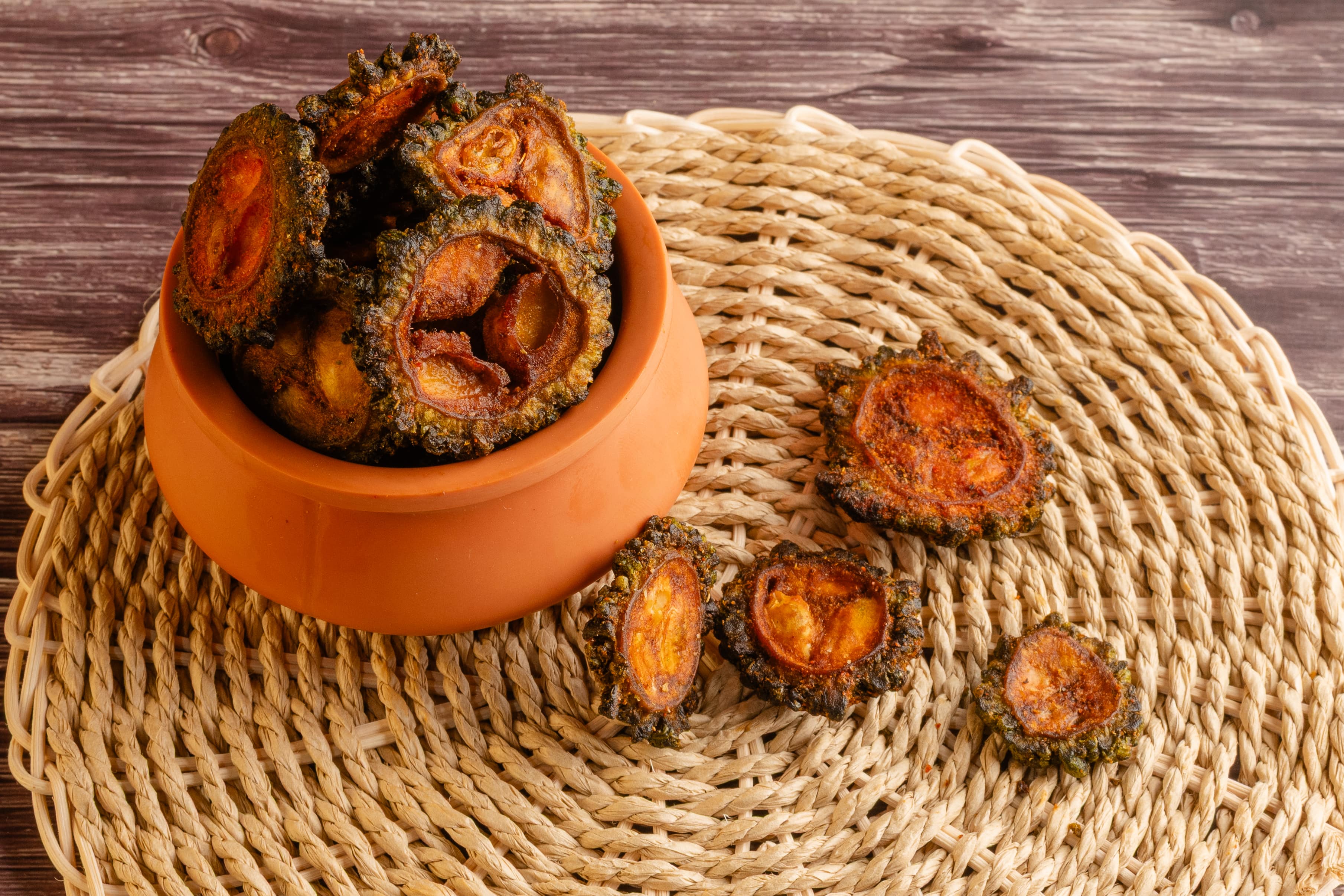 Buy karela chips online from World of Mysore Pak. Crispy, guilt-free bitter gourd chips with reduced oil content.