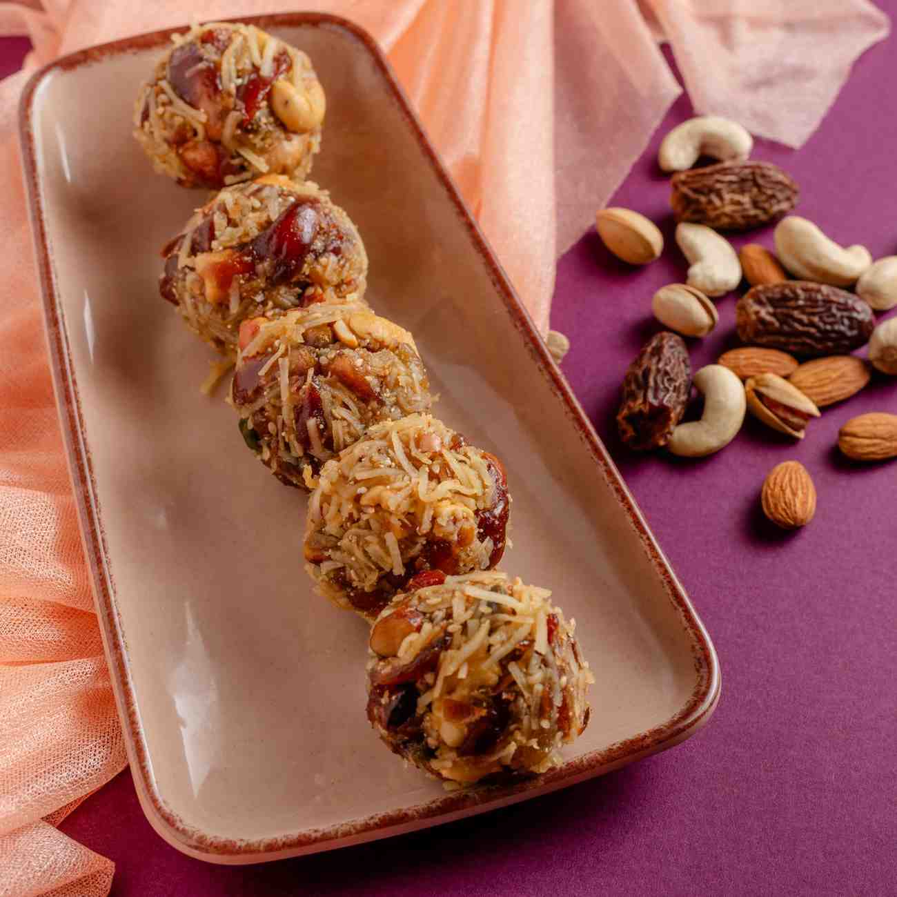 Buy Dry Fruit Ladoo online from World of Mysore Pak — a healthy mix of dates, ghee, and nuts in every bite ladoo.