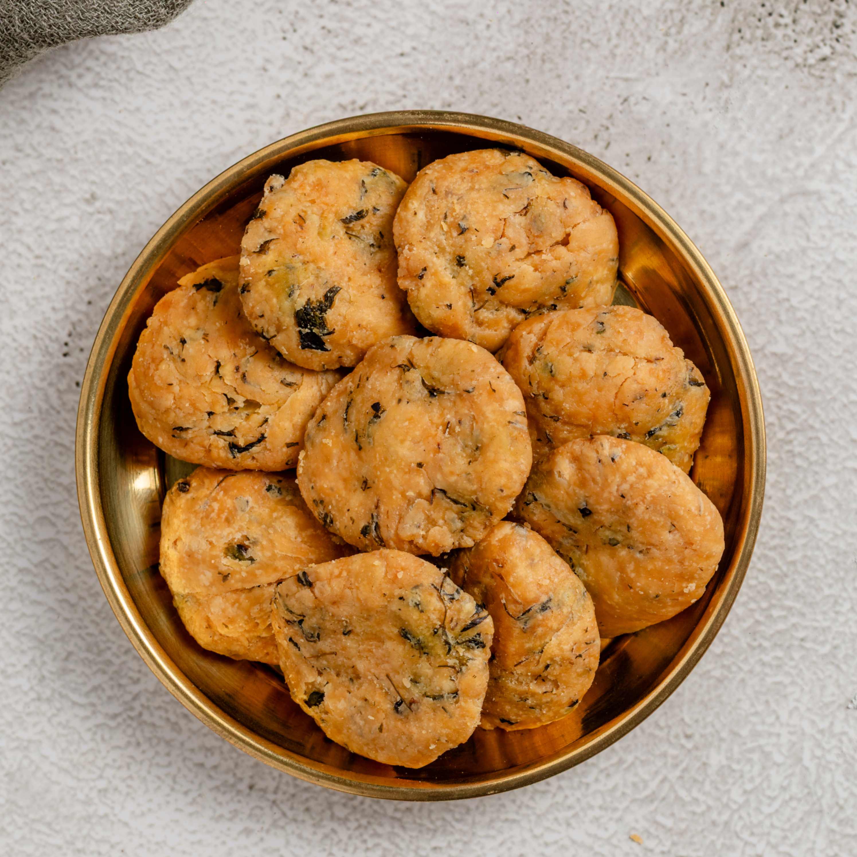 Buy Meethi Matri snack online from World of Mysore Pak – savory, flaky delight with methi and mild spices.