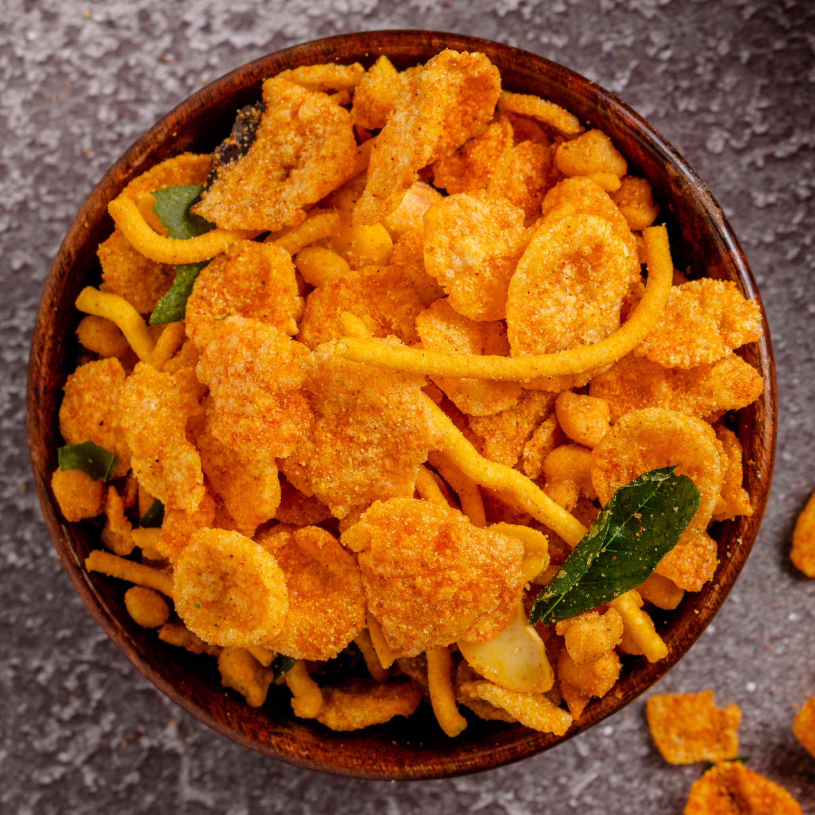 Buy Indian Mixture namkeen online from World of Mysore Pak – a traditional snack perfect for teatime or anytime munching.