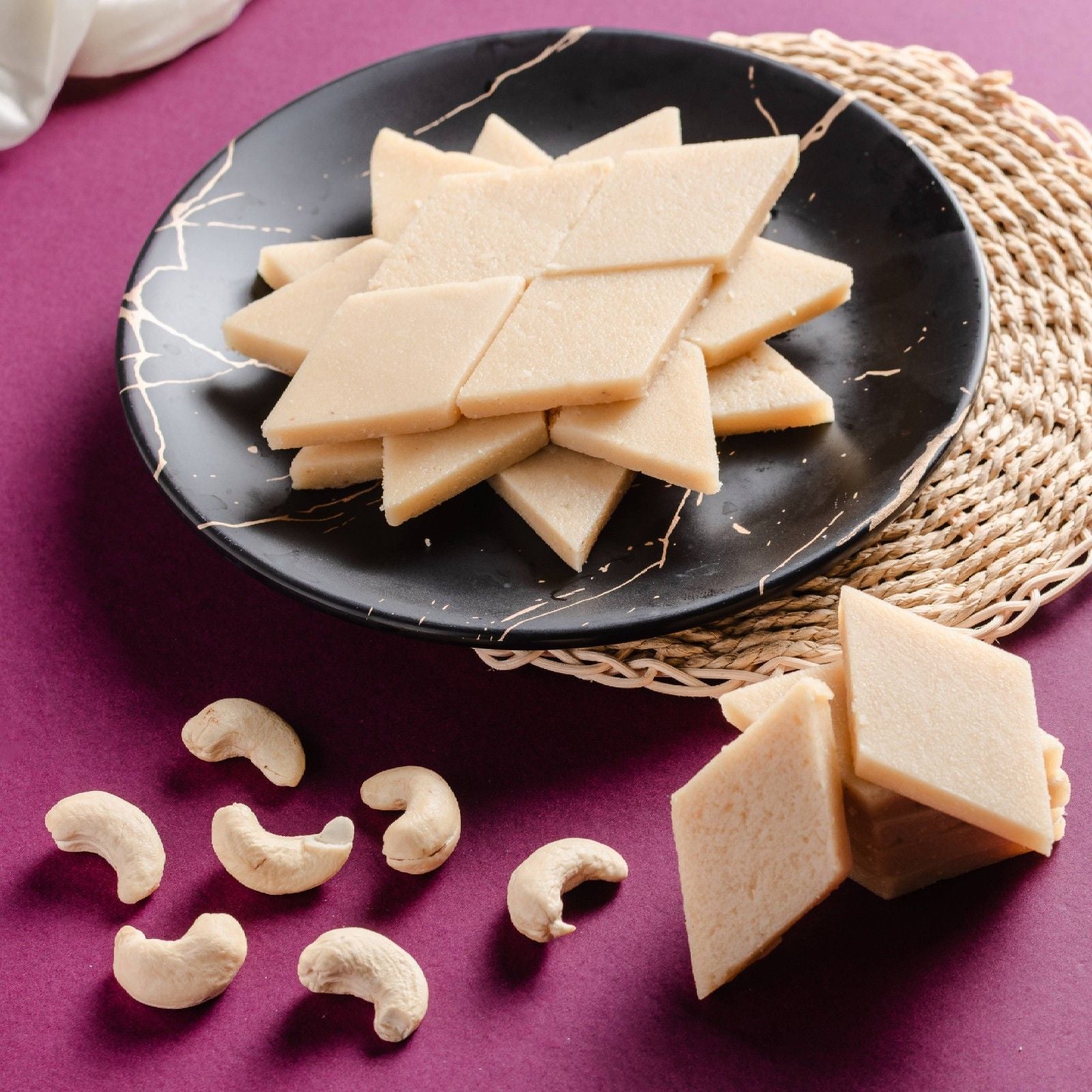 Buy Cashew Barfi online from World of Mysore Pak – ghee and kaju paste blend for a traditional, tasty treat.