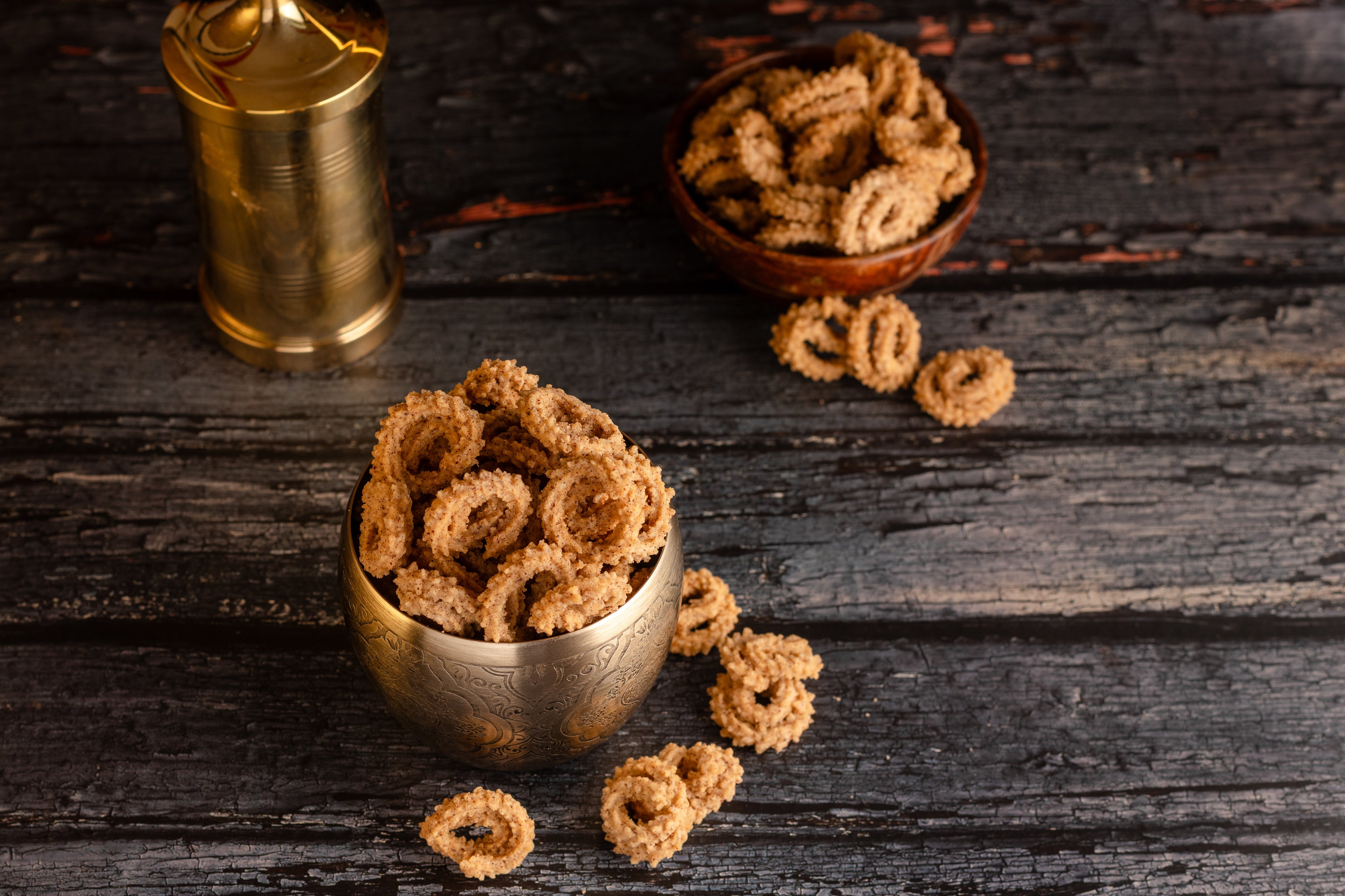 Buy Ragi Chakkuli online from World of Mysore Pak – crisp spiral snack made with ragi flour for a healthy, earthy crunch.