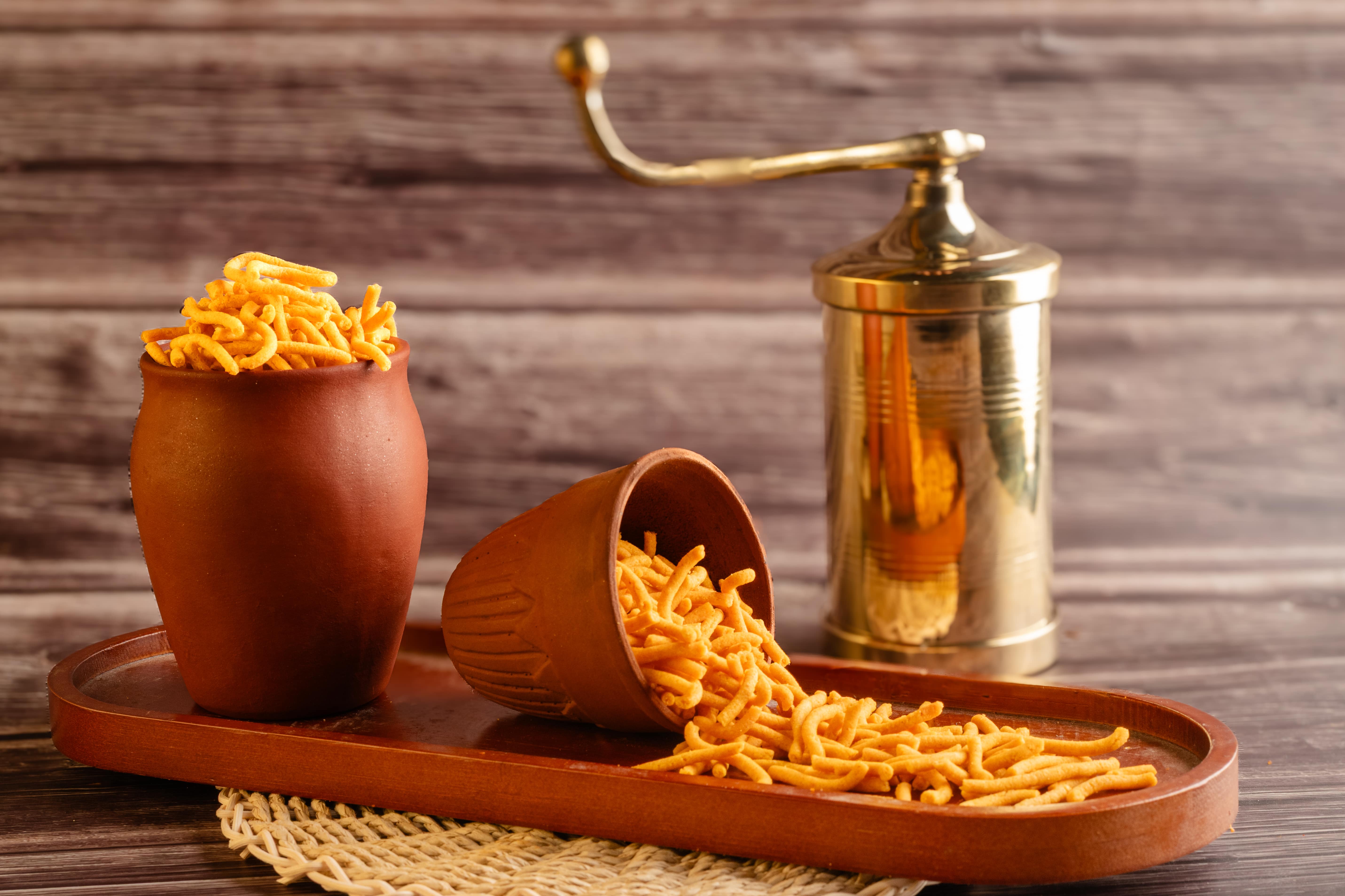 Buy Om Pudi online from World of Mysore Pak. Thin and crispy ajwain-flavored snack with mild spices.