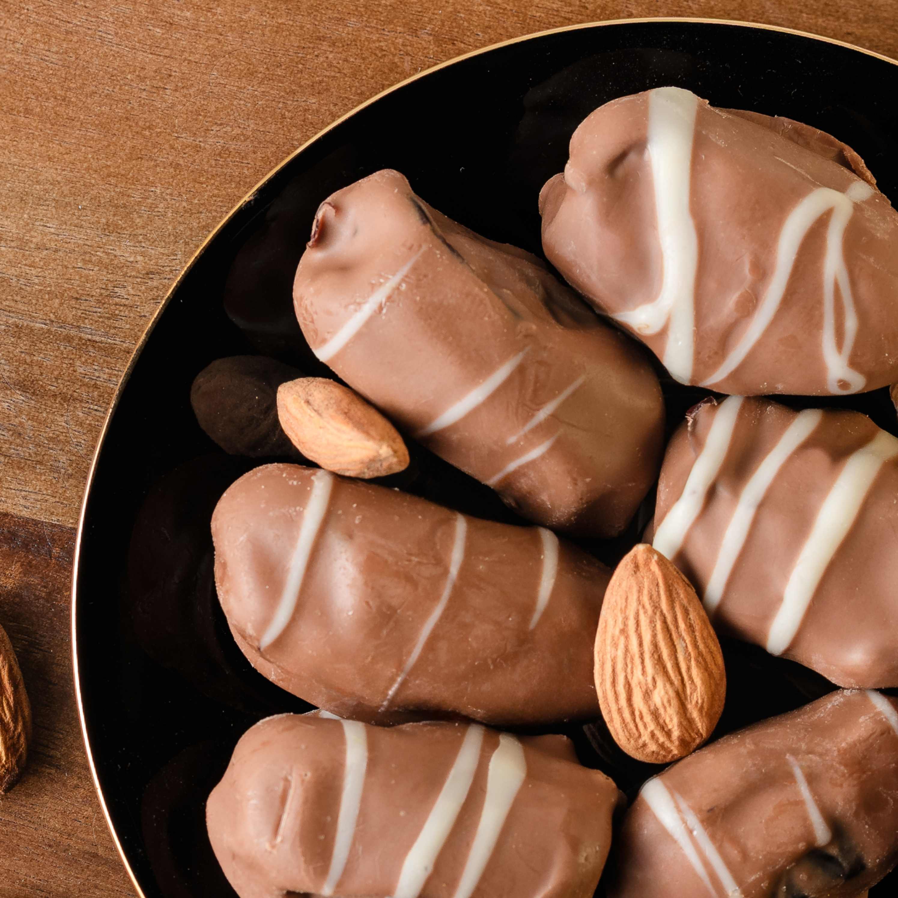 Buy Almond Filled Dates and Chocolate-Covered Dates online from World of Mysore Pak – luxurious bites crafted for you.