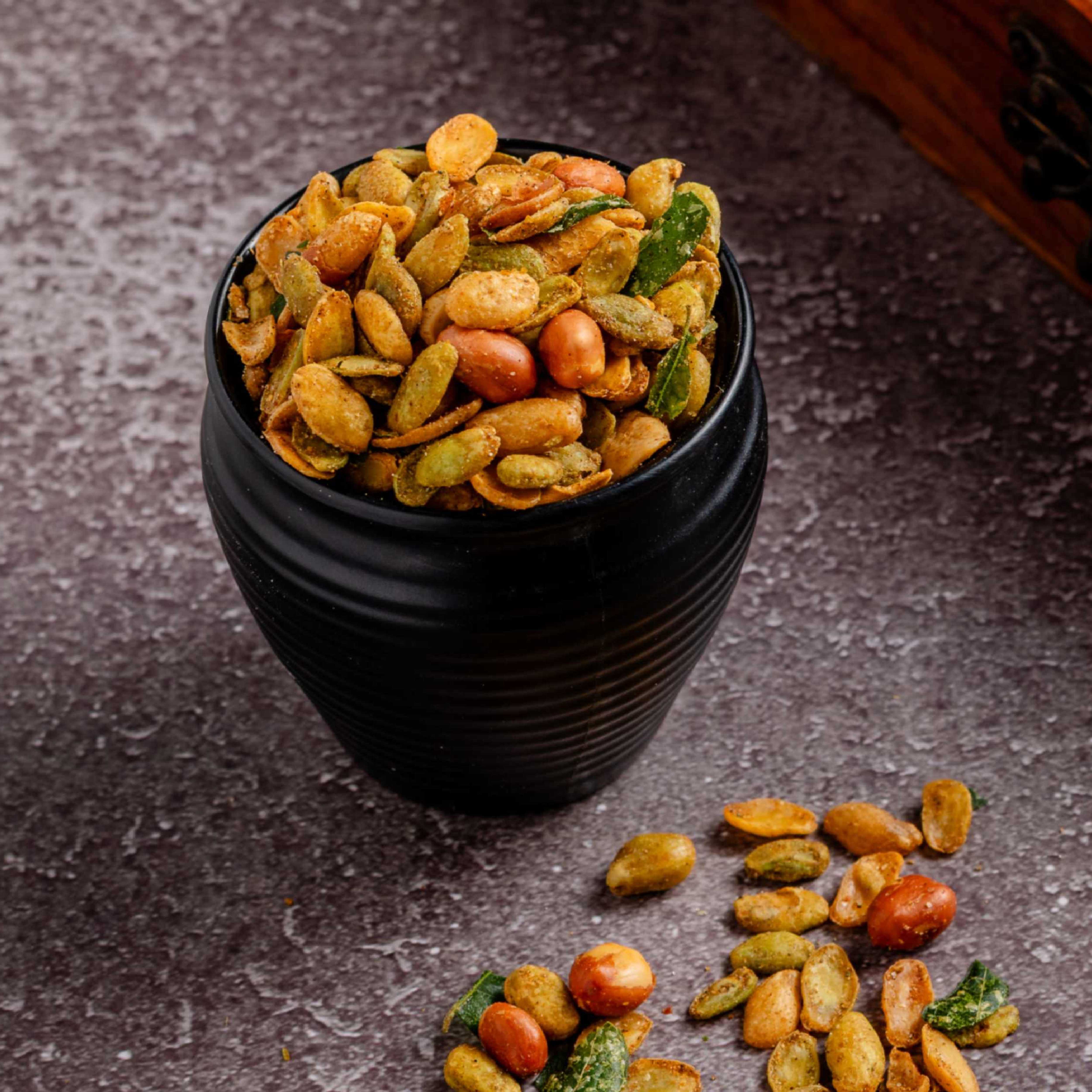 Buy Avarekalu Mixture online from World of Mysore Pak – crispy avarekalu, peanuts, and aromatic curry leaves.