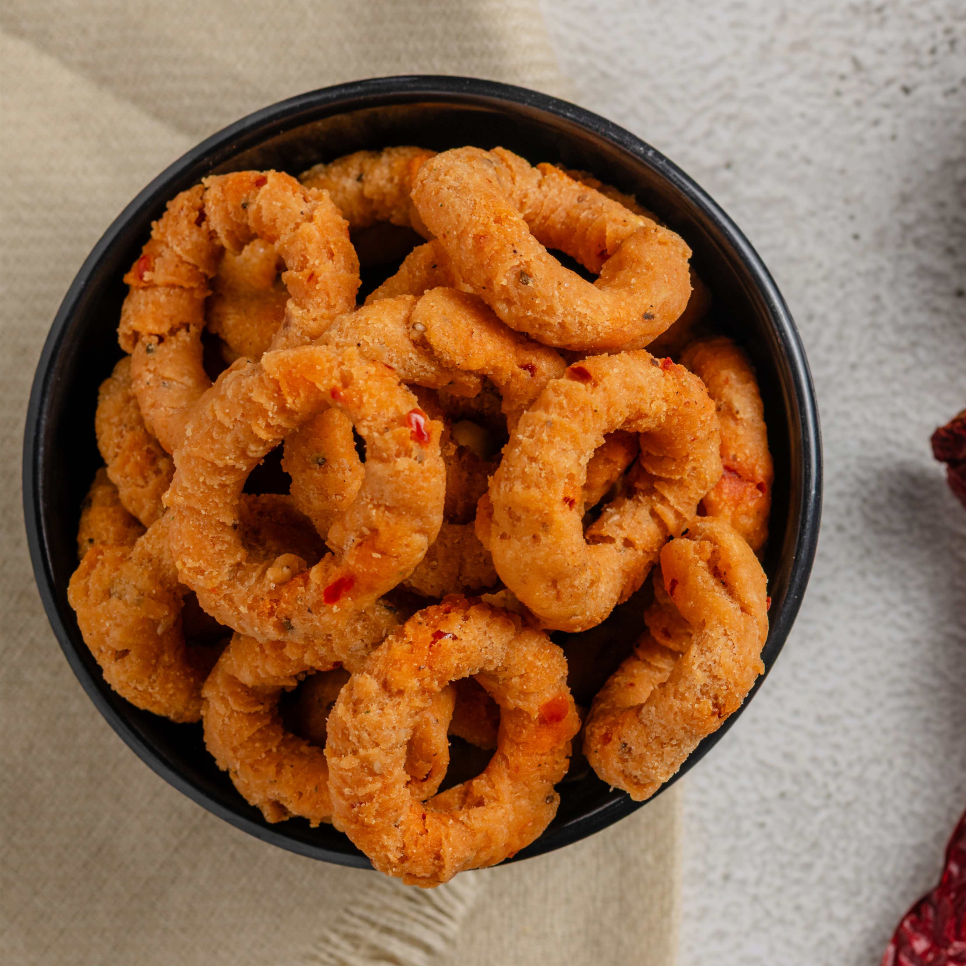 Buy Andhra Ring Murukku online from World of Mysore Pak – spicy, crispy South Indian snack packed with bold flavor.