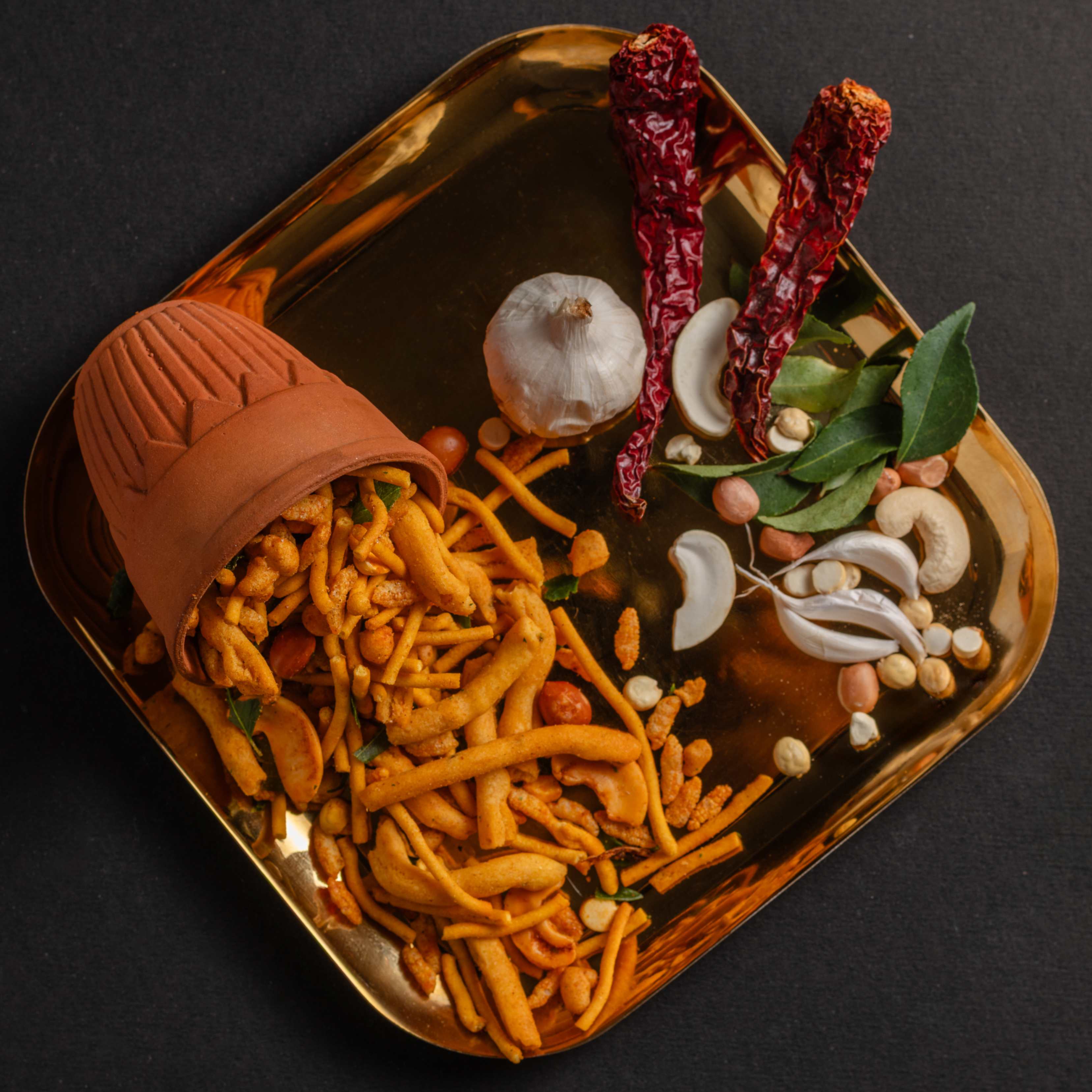 Buy crunchy Garlic namkeen online from World of Mysore Pak – traditional flavor with a spicy garlic kick in every bite.