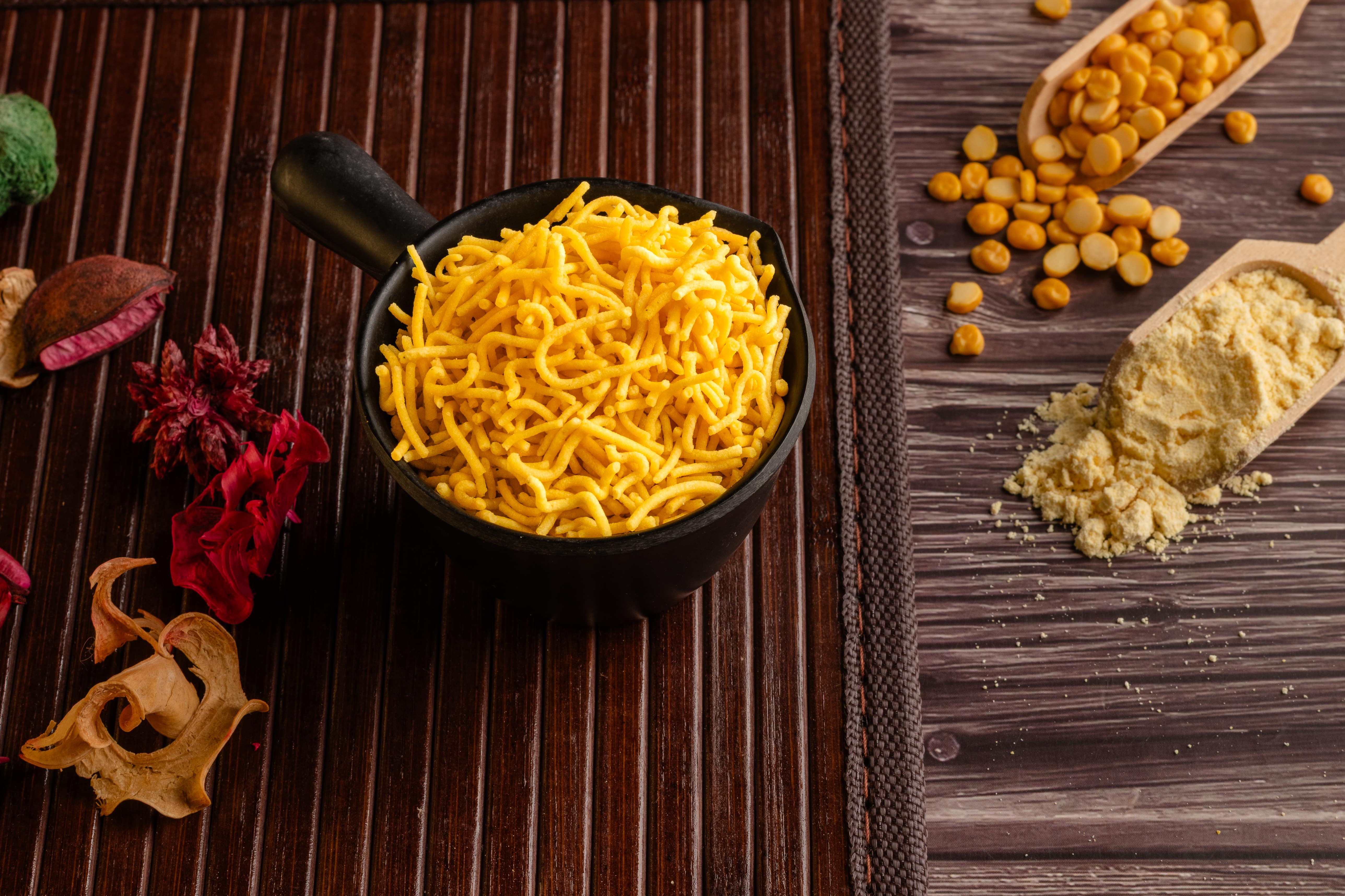 Buy Besan Sev online from World of Mysore Pak. Deep-fried to golden perfection and mildly spiced for daily snacking.