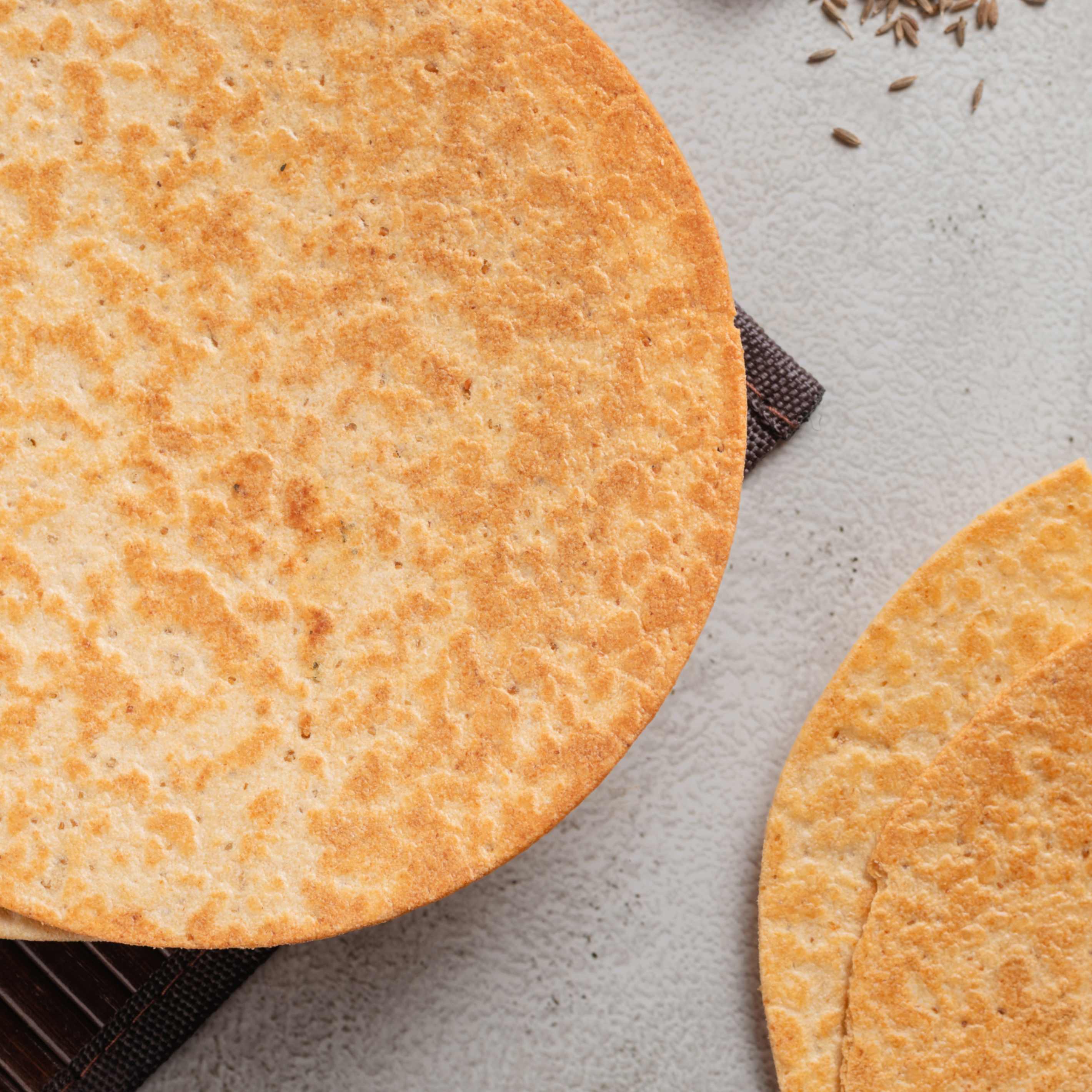 Buy Jeera Khakhra online from World of Mysore Pak. A cumin-seasoned crisp perfect for light munching.
