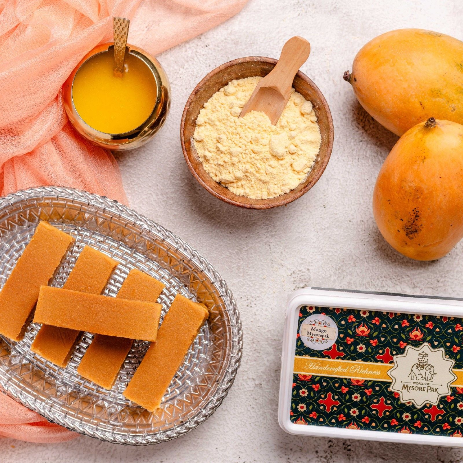 Buy Mango Mysore Pak online from World of Mysore Pak — a fruity Indian sweet made with 100% ghee and mango pulp.