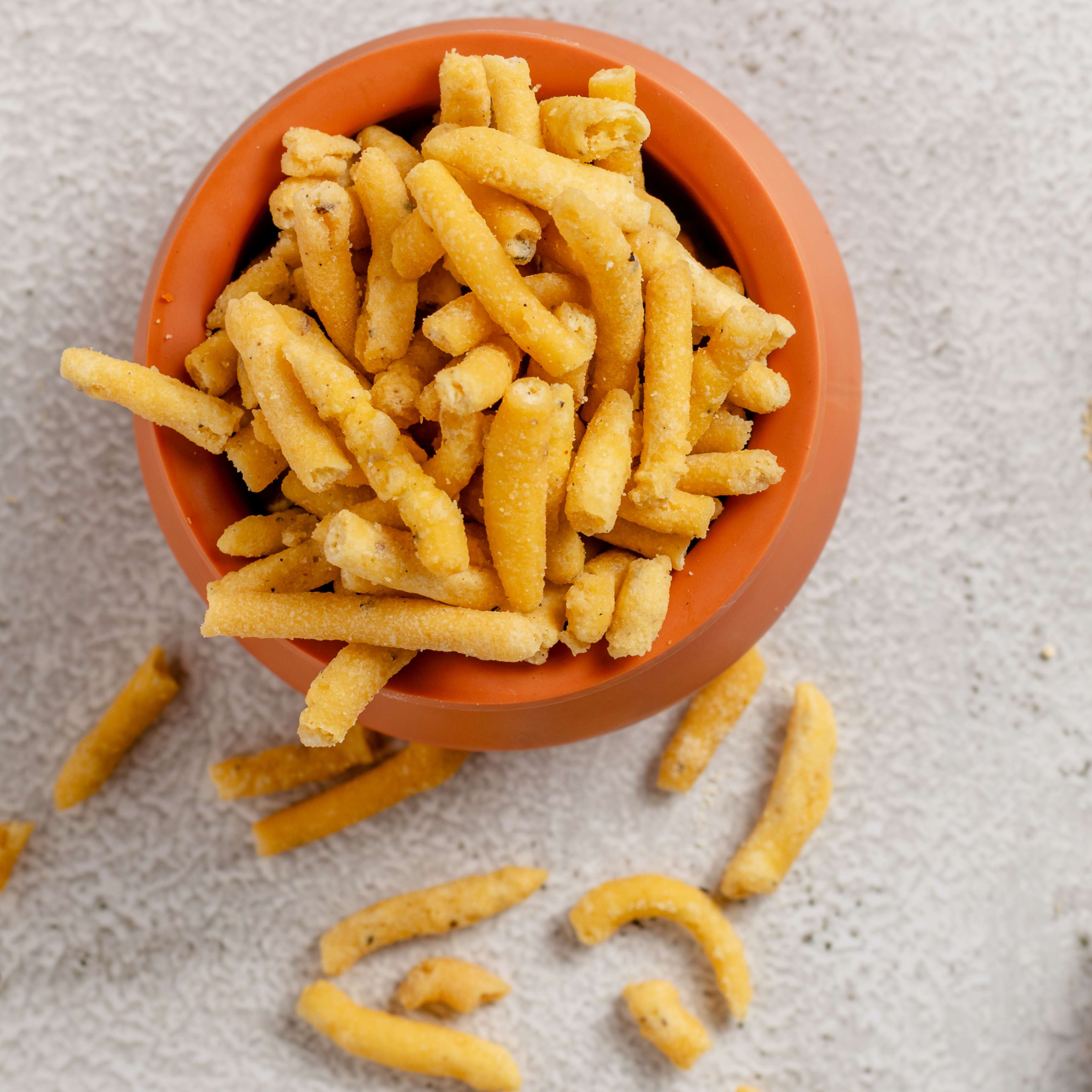 Buy Masala Sev snacks online from World of Mysore Pak – flavorful mix of mota sev, spicy shev, and classic besan crunch.