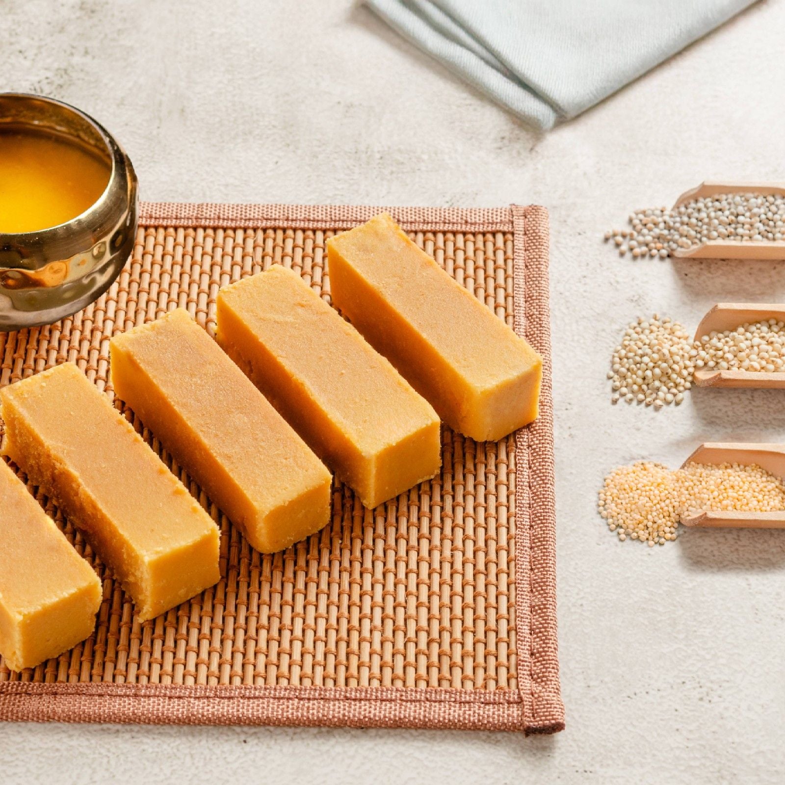Buy healthy Millet Mysore Pak online from World of Mysore Pak, nutrient bites with ghee and a soft, earthy texture.