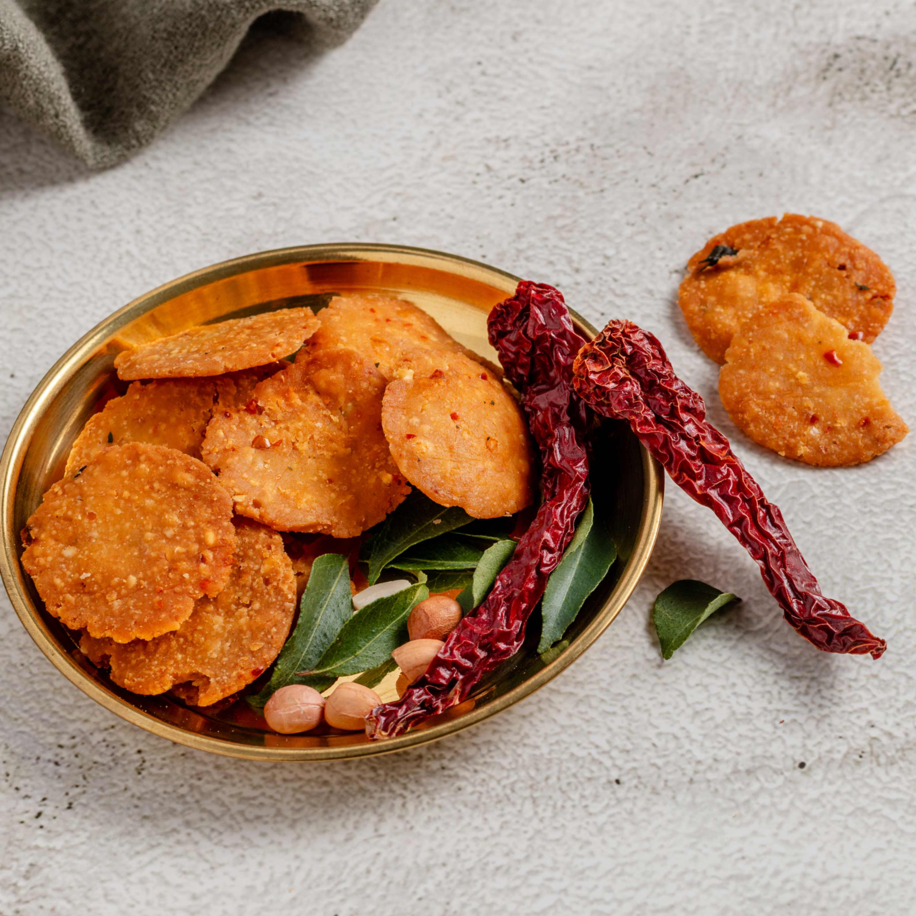 Buy Mini Nippattu online from World of Mysore Pak. A crunchy, handmade snack with bold flavor and bite-sized texture.
