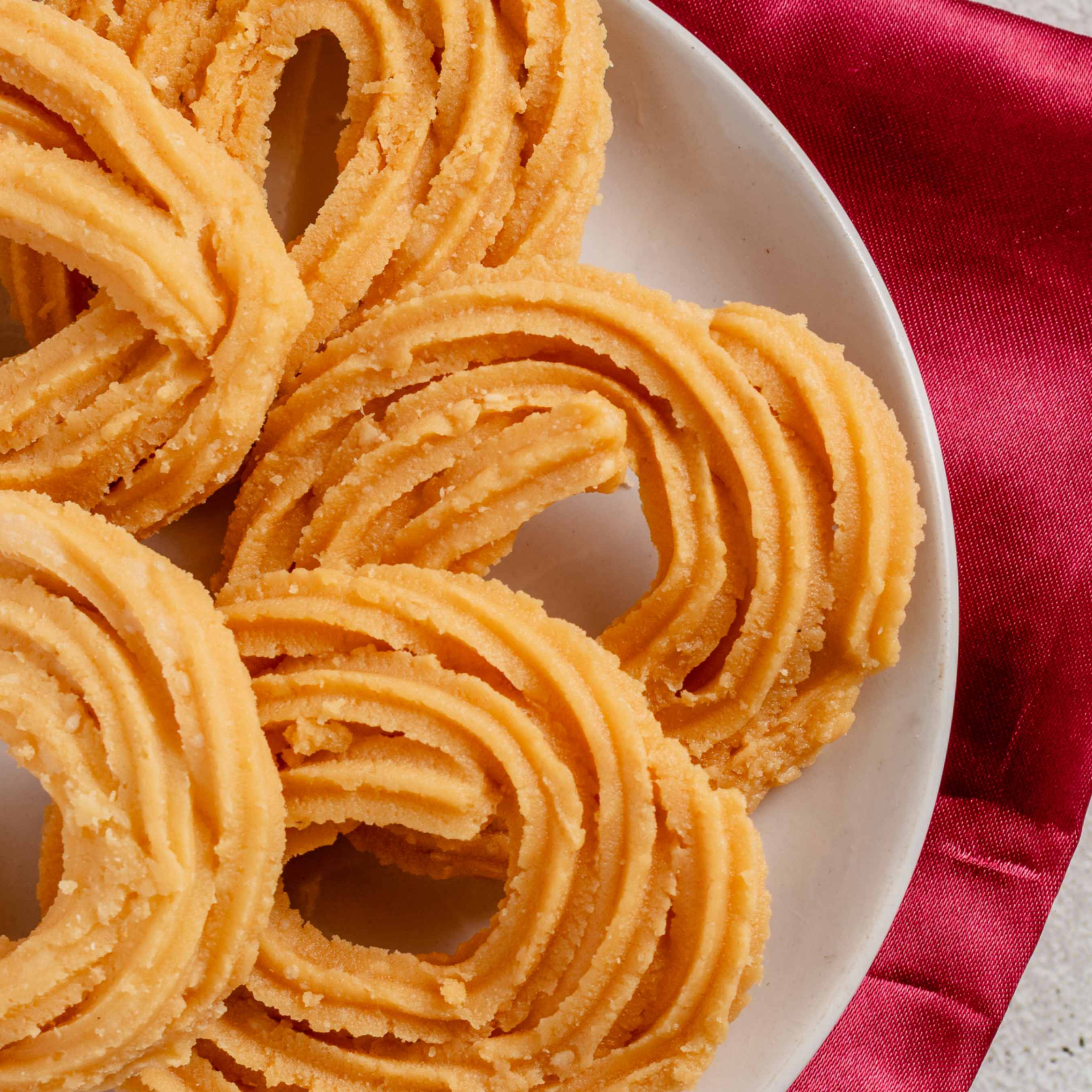 Buy Murukku online from World of Mysore Pak – traditional crunchy snack made with urad dal and rice flour.