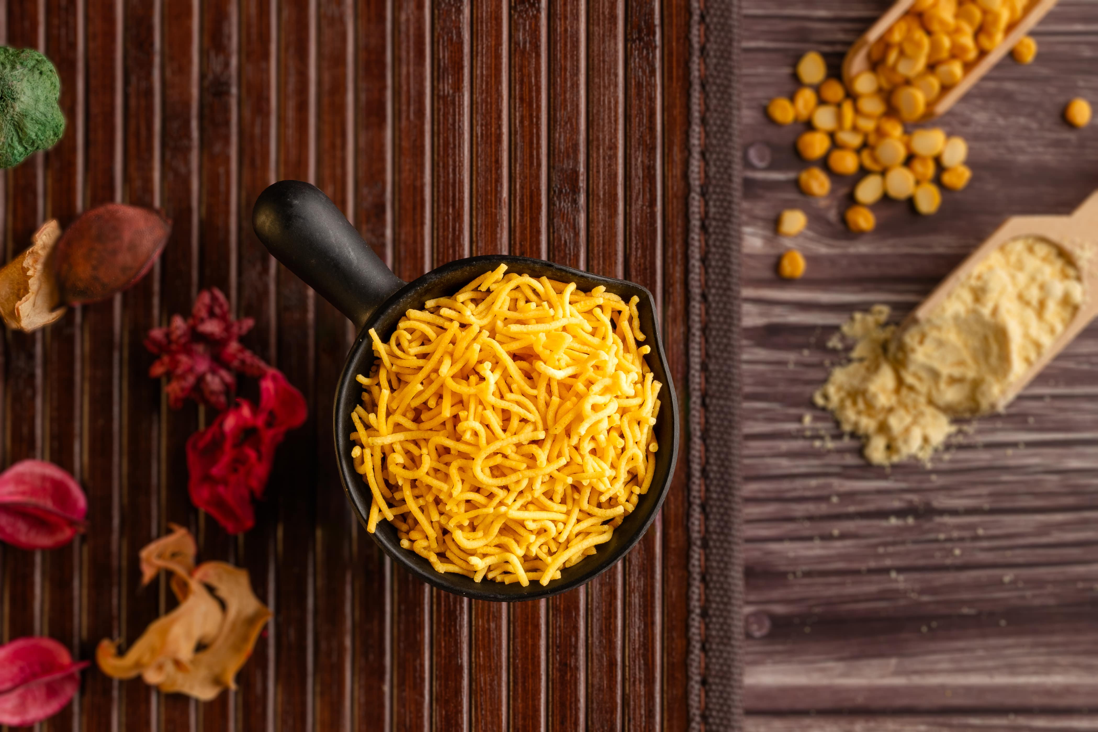Buy namkeen Sev online from World of Mysore Pak. Thin, crunchy strands of besan sev that melt in your mouth.