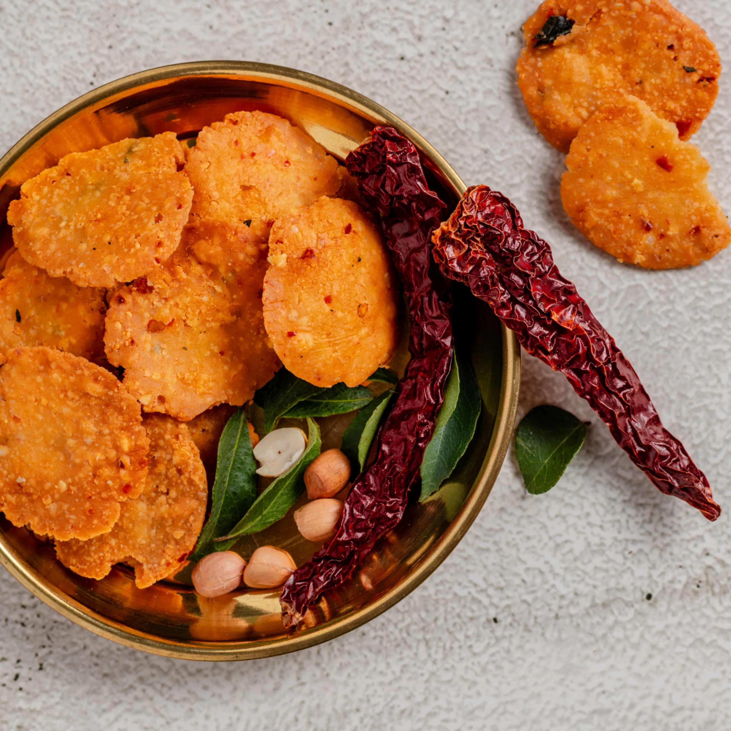 Buy Nippattu snacks online from World of Mysore Pak – crispy, spiced rice flour bites perfect with tea or coffee.
