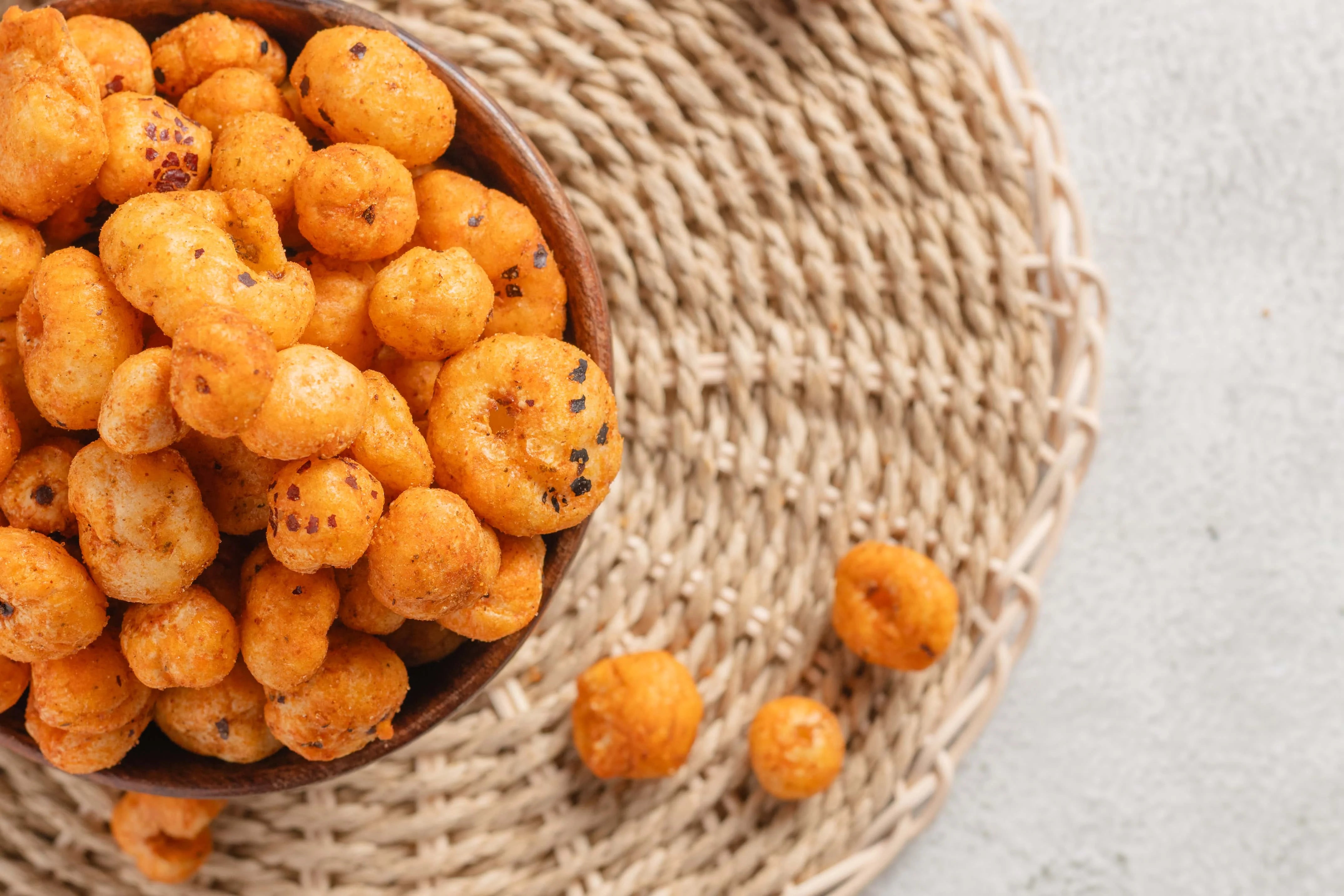 Buy Peri Peri Makhana online from World of Mysore Pak. Roasted makhana coated in spicy peri peri seasoning.