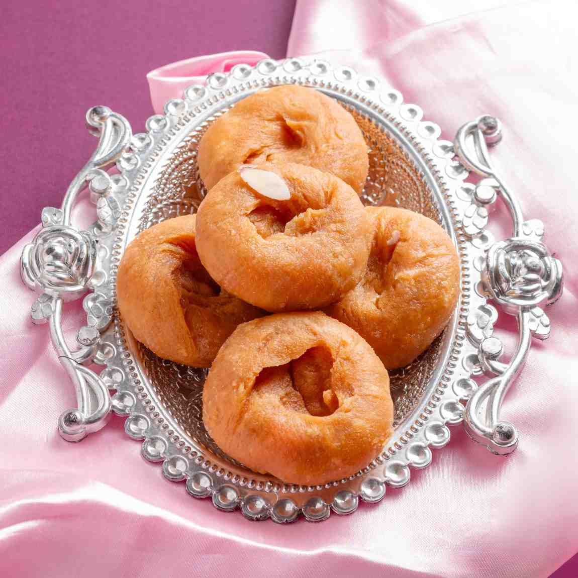 Buy Badusha online from World of Mysore Pak,  a classic sweet with flaky layers, made with sugar and pure ghee.