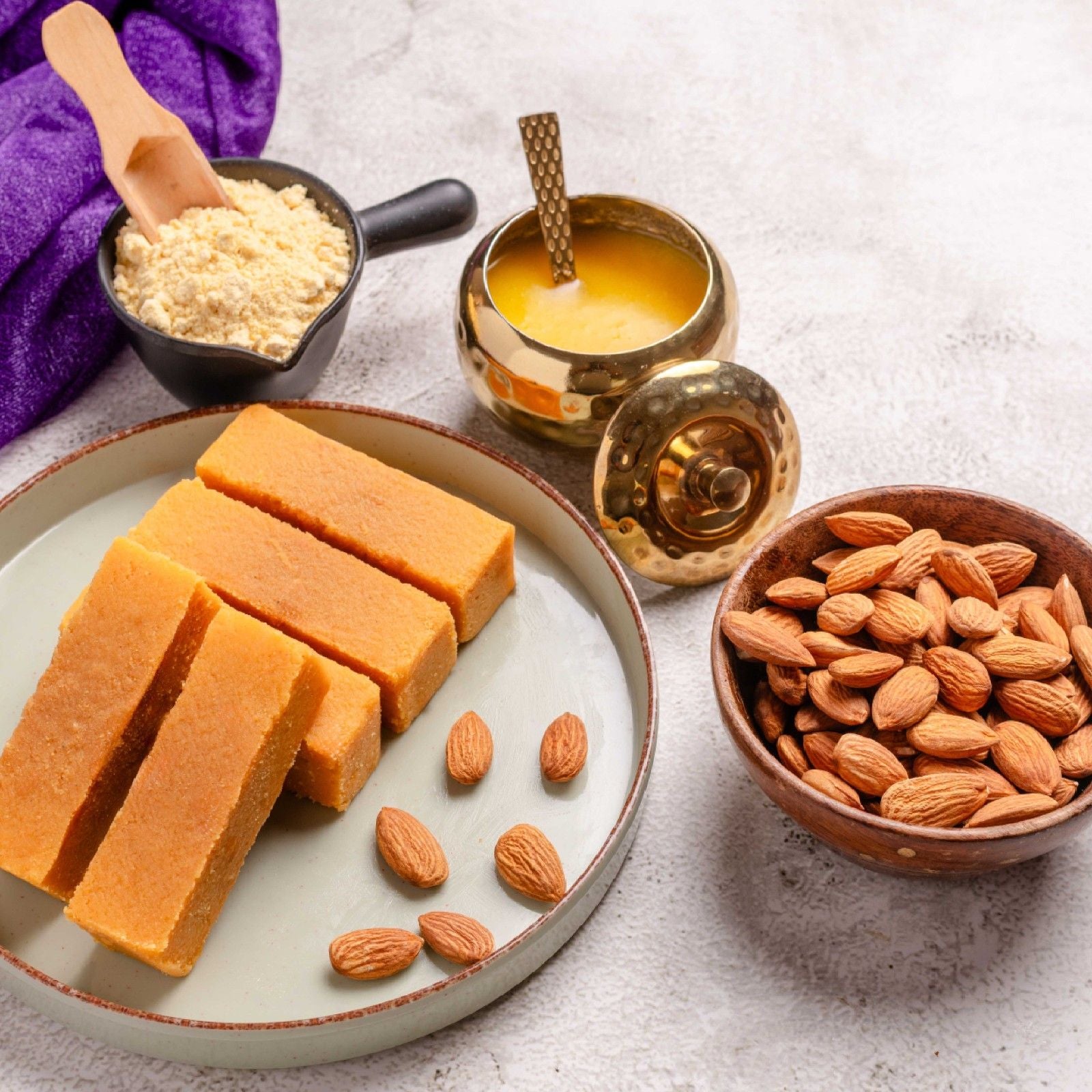 Buy Almond Mysore Pak online from World of Mysore Pak – rich roasted sweet with pure ghee and crunchy badam flavor.