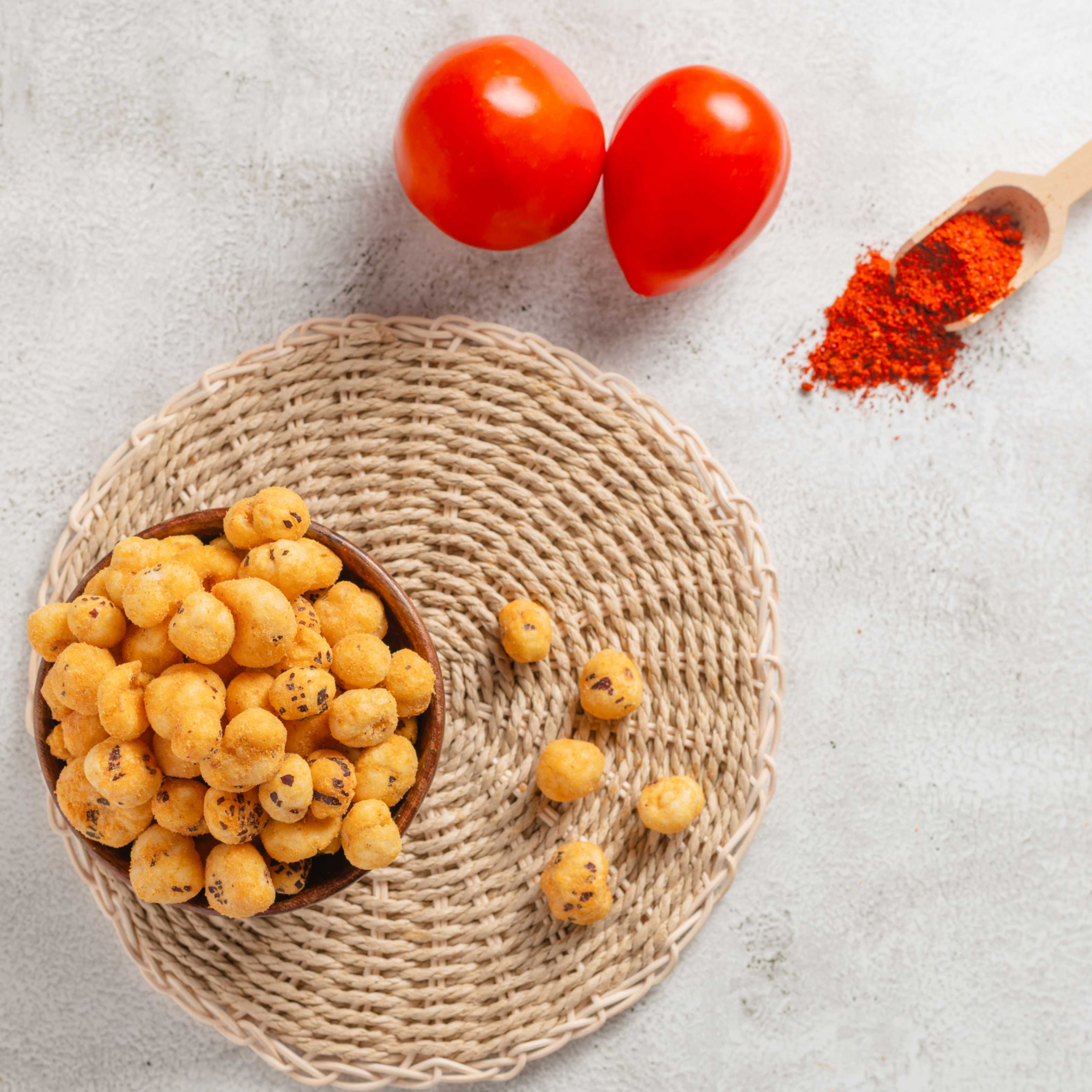 Buy Tangy Tomato Makhana online from World of Mysore Pak – crunchy bites with tomato and rich cheese flavor.